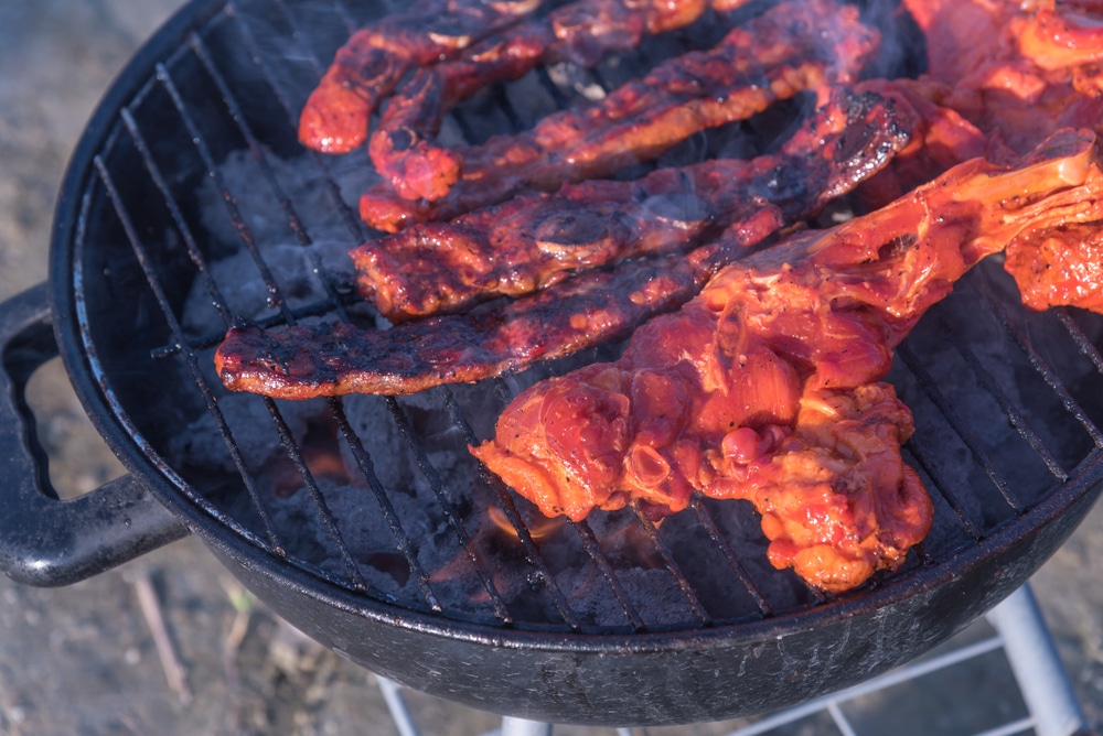 Close-up,,Top,View,Of,Pork,And,Meat,Skewers,Being,Grilled